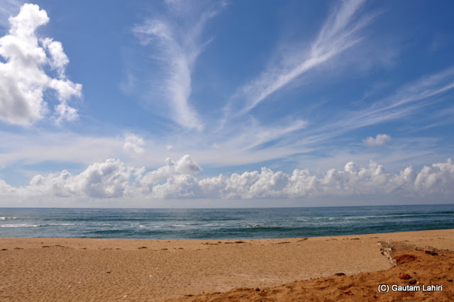 The continuously changing pattern of the clouds painted different images of sea, sand and sky  at Puri, Bhubaneshwar, Odisha, India by Gautam Lahiri